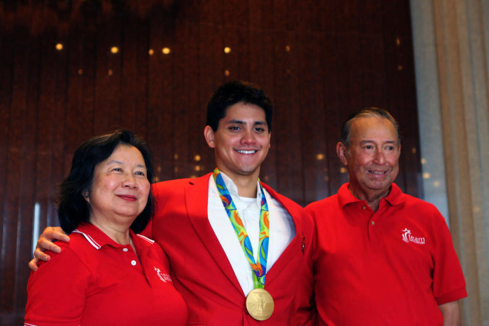 Joseph Schooling in Parliament with his parents, May and Colin Schooling. (Yahoo Newsroom)