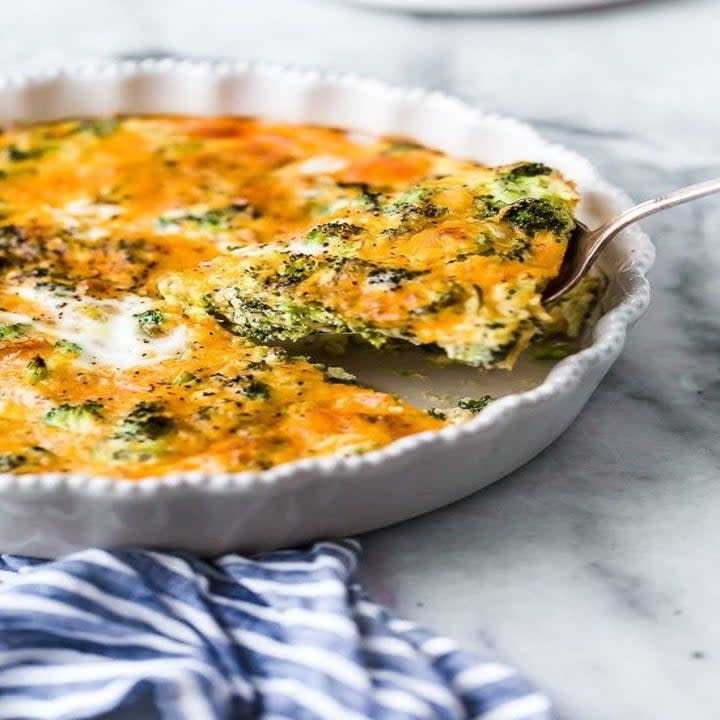 A broccoli and cheese quiche in a baking dish.