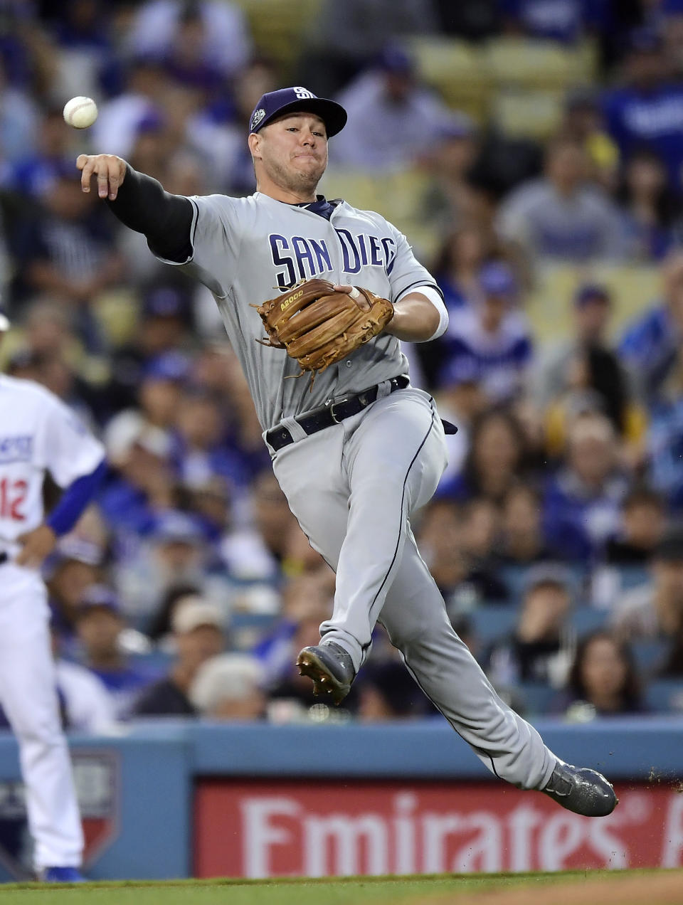 San Diego Padres third baseman Ty France attempts to throw out Los Angeles Dodgers' Corey Seager at first during the second inning of a baseball game Wednesday, May 15, 2019, in Los Angeles. Seager was safe at first on the play. (AP Photo/Mark J. Terrill)