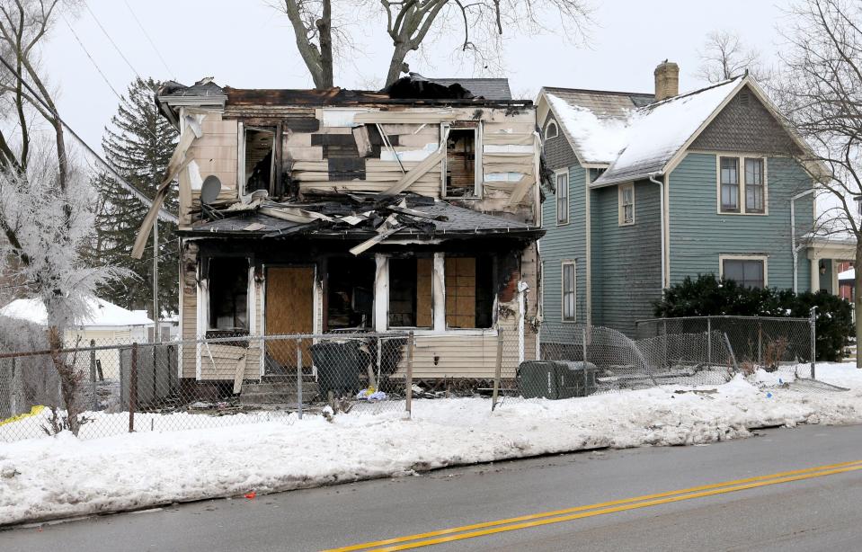 The burned-out shell of a two-story house is quiet Monday, Jan. 22, 2024, after a residential fire Sunday night at 222 N. LaPorte Ave. in South Bend. Five children died in the blaze.