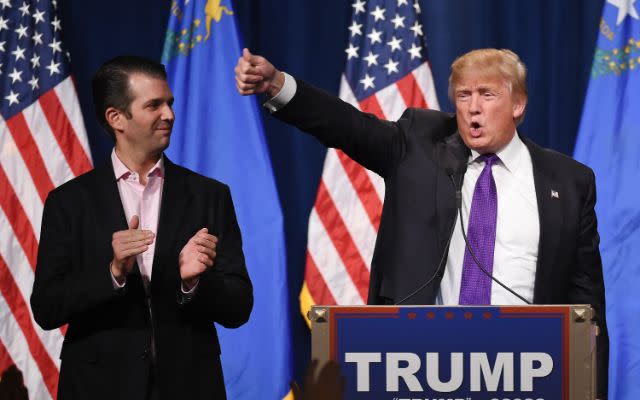 LAS VEGAS, NV – FEBRUARY 23: Donald Trump Jr. (L) looks on as his father, Republican presidential candidate Donald Trump, waves after speaking at a caucus night watch party at the Treasure Island Hotel & Casino on February 23, 2016 in Las Vegas, Nevada. The New York businessman won his third state victory in a row in the “first in the West” caucuses. (Photo by Ethan Miller/Getty Images)