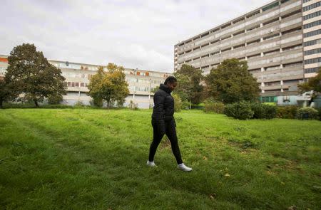 A resident walks through a partially abandoned part of the Aylesbury Estate in south London, Britain October 15, 2015. REUTERS/Neil Hall