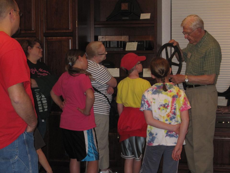 George Mead describes the metal casting process for paper machine parts to a tour group at the Wisconsin River Papermaking Museum in Wisconsin Rapids.