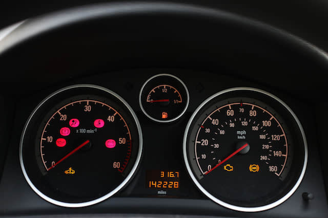 Displays on car dashboard showing an empty fuel gauge.