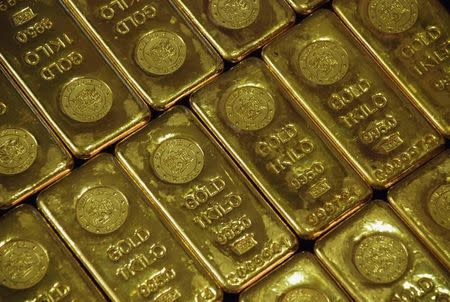 Gold prices lose ground after upbeat U.S. GDP report