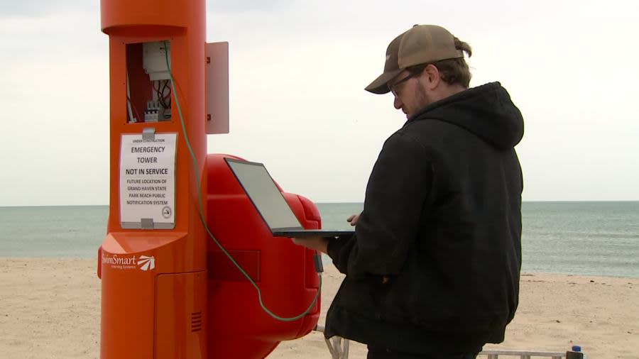 Inventor Jacob Soter works on a new emergency tower at Grand Haven State Park. (May 14, 2024)