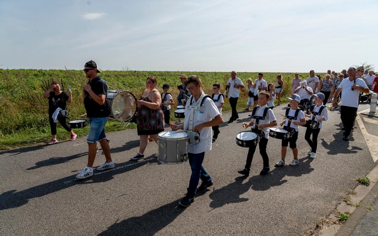 The village parade commemorating the liberation and the tragedy