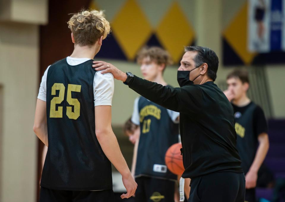 OLSH's Bryson Kirschner talks with coach Mike Rodriguez during practice Tuesday. [Lucy Schaly/For BCT]