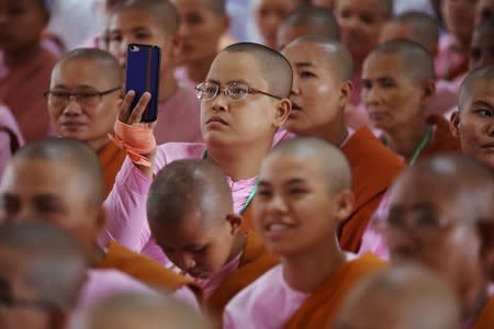 Buddhist nuns take photo during the annual meeting of the nationalist group Buddha Dhamma Parahita Foundation, previously known as Ma Ba Tha in Yangon