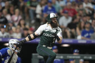 Colorado Rockies' Charlie Blackmon watches his RBI single off Toronto Blue Jays relief pitcher Yimi Garcia during the fifth inning of a baseball game Saturday, Sept. 2, 2023, in Denver. (AP Photo/David Zalubowski)