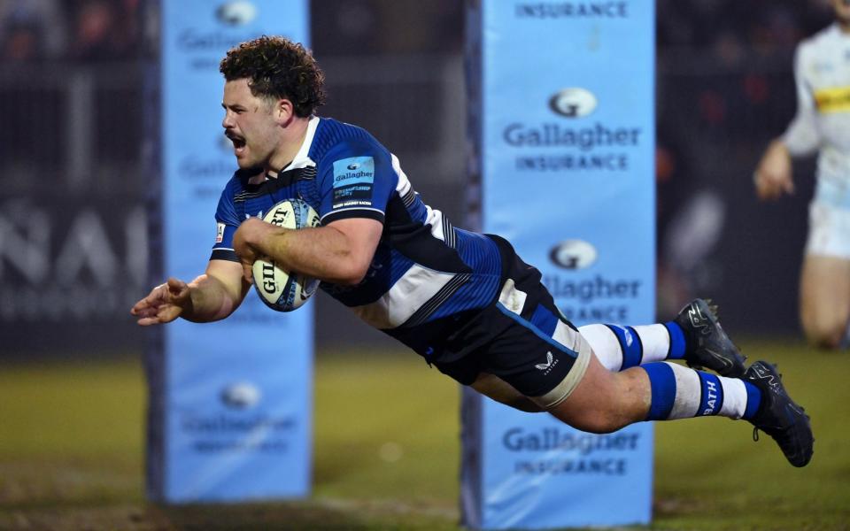 Alfie Barbeary of Bath Rugby dives onto the Exeter Chiefs try-line to score his team's fifth try during the Gallagher Premiership Rugby match between Bath Rugby and Exeter Chiefs at The Recreation Ground on December 2, 2023 in Bath, England