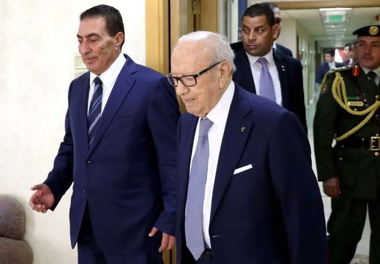 Tunisian President Beji Caid Essebsi (R), photographed in Jordan on October 20, 2015, canceled a planned trip to Switzerland and declared a state of emergency after a bomb exploded in the capital city of Tunis on November 24