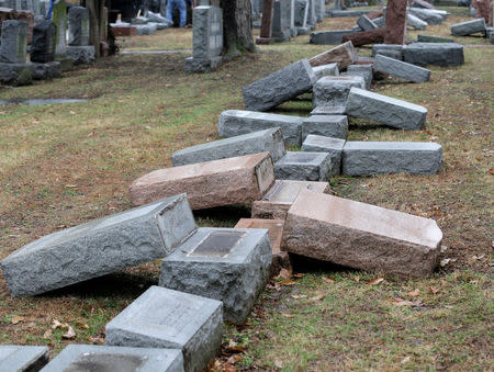 A row of more than 170 toppled Jewish headstones is seen after a weekend vandalism attack on Chesed Shel Emeth Cemetery in University City, a suburb of St Louis, Missouri, U.S. February 21, 2017. REUTERS/Tom Gannam