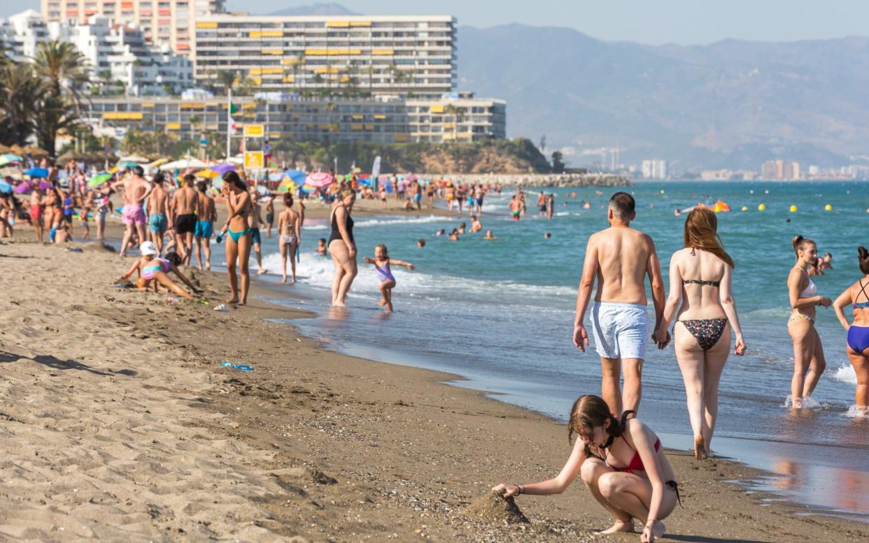 People enjoy the sunshine at Torremolinos, near Malaga - David Benito/Getty Images Europe