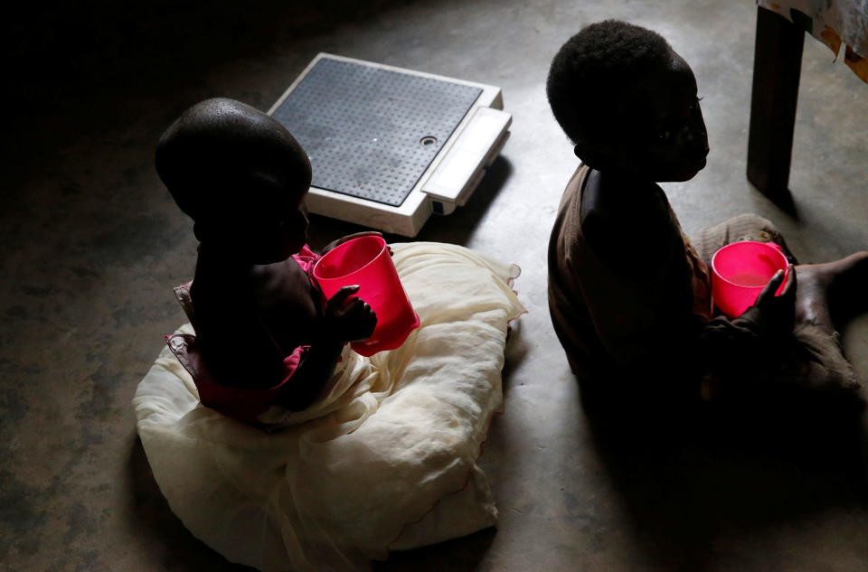 <p>Severely acute malnourished and internally displaced Congolese children drink porridge as they wait to receive medical attention at the Tshiamala general referral hospital of Mwene Ditu in Kasai Oriental Province in the Democratic Republic of Congo, March 15, 2018. (Photo: Thomas Mukoya/Reuters) </p>