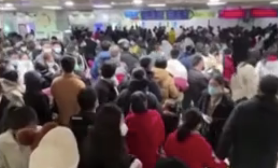 Hundreds queue for treatment at the Beijing Children's Hospital in China after a surge in respiratory illnesses. (Reuters)