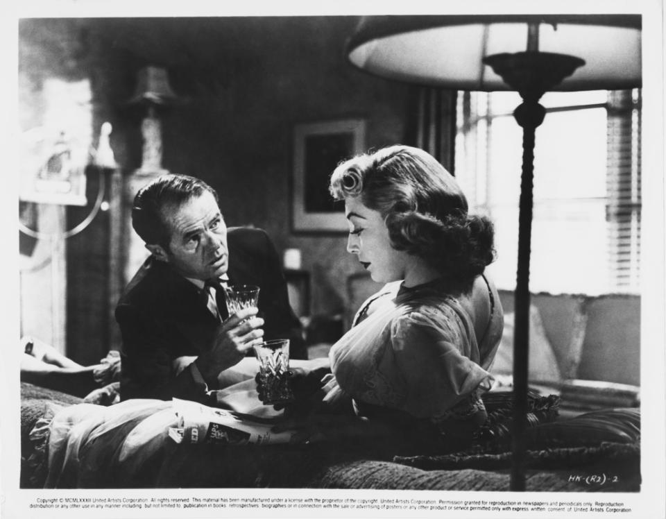 American actor Elisha Cook, Jr. (1903 - 1995) as George Peatty with Marie Windsor (1919 - 2000) as his wife Sherry, in a still from the film 'The Killing', 1956. The film was directed by Stanley Kubrick for United Artists. (Photo by United Artists/Archive Photos/Getty Images)