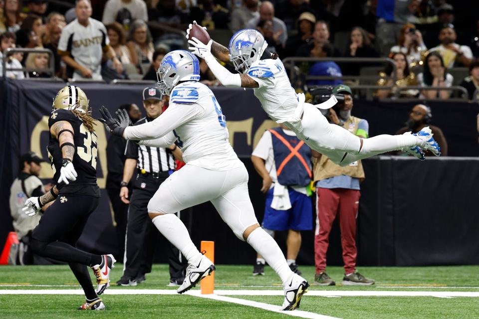 Lions wide receiver Jameson Williams dives to the end zone for a touchdown during the second half of the Lions' 33-28 win on Sunday, Dec. 3, 2023, in New Orleans.