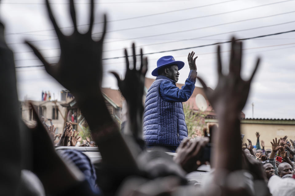 Presidential candidate Raila Odinga waves to his supporters after casting his vote at the Kibera Primary School in Nairobi, Kenya, Tuesday, Aug. 9, 2022. Kenyans are voting to choose between opposition leader Raila Odinga and Deputy President William Ruto to succeed President Uhuru Kenyatta after a decade in power. (AP Photo/Mosa'ab Elshamy)