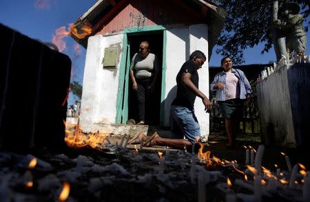 A devotee walks on his knees around a chapel to make an offering to Sao Joao do Guarani (Saint Joao of Guarani) during an annual celebration in Chico Mendes Extraction Reserve in Xapuri, Acre state, Brazil, June 24, 2016. REUTERS/Ricardo Moraes