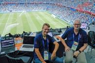 FILE PHOTO: Reuters journalists Andrew Cawthorne (L) and Mark Gleeson sit in the media tribune during the match between Croatia and Denmark at the Nizhny Novgorod Stadium, Nizhny Novgorod, Russia, July 1, 2018. REUTERS/Max Rossi/File Photo