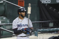 FILE - Miami Marlins' Monte Harrison stands at the on deck circle during the third inning of a baseball game in Baltimore, in this Tuesday, Aug. 4, 2020, file photo. Marlins outfield prospect Monte Harrison says he surprised himself when he made his major league debut last year. “I said I was not going to be that guy who gets called up to the big leagues and struggles mentally,” Harrison said. “And then when I got to the big leagues, I struggled mentally. That’s very humbling.” (AP Photo/Julio Cortez, File)