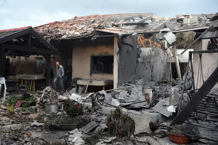 A damaged house that was hit by a rocket can be seen north of Tel Aviv, Israel, March 25, 2019. REUTERS/Yair Sagi