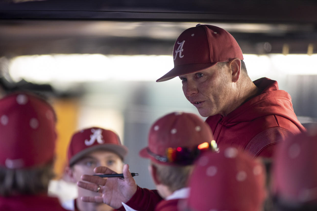 Alabama head coach Brad Bohannon talks with his team in the dugout after Alabama rallied in the bottom of the ninth for a 5-4 win over Xavier at an NCAA baseball game on Friday, Feb. 18, 2022, in Tuscaloosa, Ala. (AP Photo/Vasha Hunt)