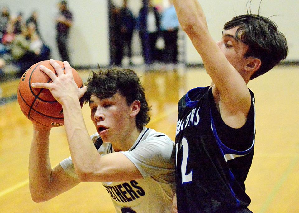 Great Plains Lutheran's Brody Scharlemann (3) attempts to get off a shot against Florence-Henry's Carson Vavruska during a high school basketball doubleheader on Thursday, Jan. 26, 2023 in Watertown.