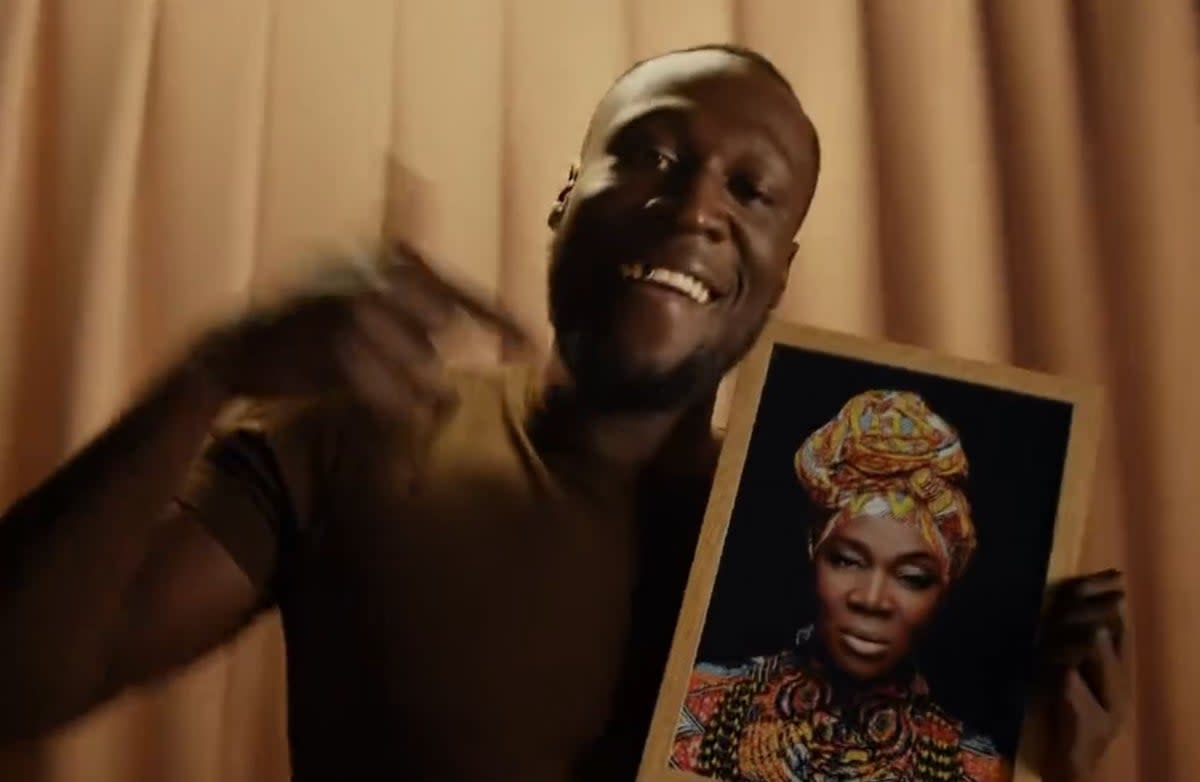 Stormzy poses with picture of India.Arie who features in his new album  (@stormzy)