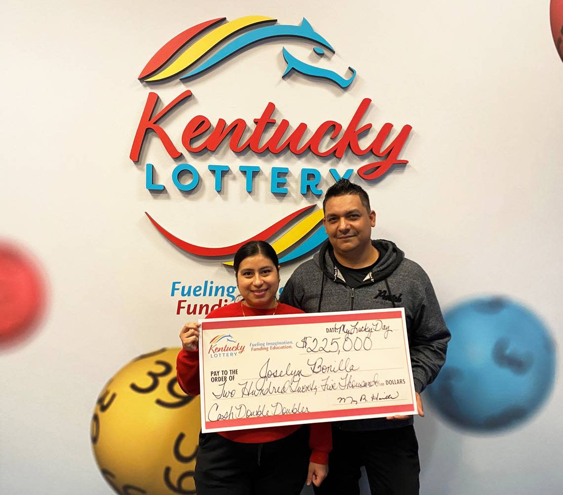 Joselyn Bonilla and her husband, of Louisville, pose with their big check after a $225,000 win on a Kentucky Lottery scratch-off ticket Monday. Kentucky Lottery