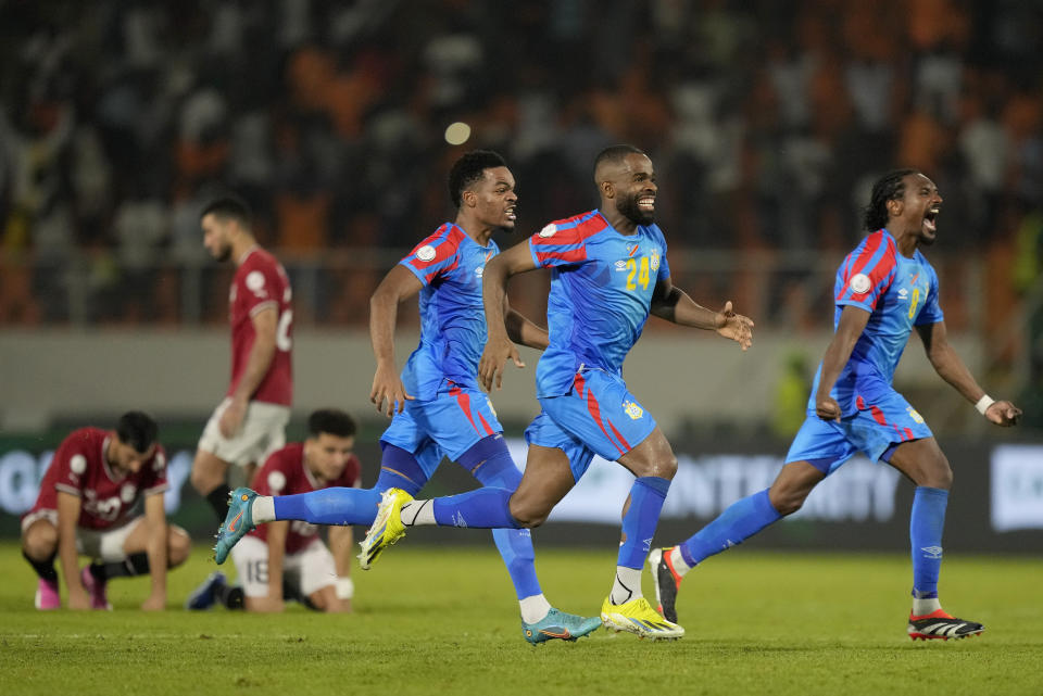 DR Congo players celebrate after goalkeeper Lionel Mpasi scored the winning goal in a penalty shootout winning 8-7 during the African Cup of Nations Round of 16 soccer match between Egypt and DR Congo, at the Laurent Pokou stadium in San Pedro, Ivory Coast, Sunday, Jan. 28, 2024. 2024. (AP Photo/Sunday Alamba)