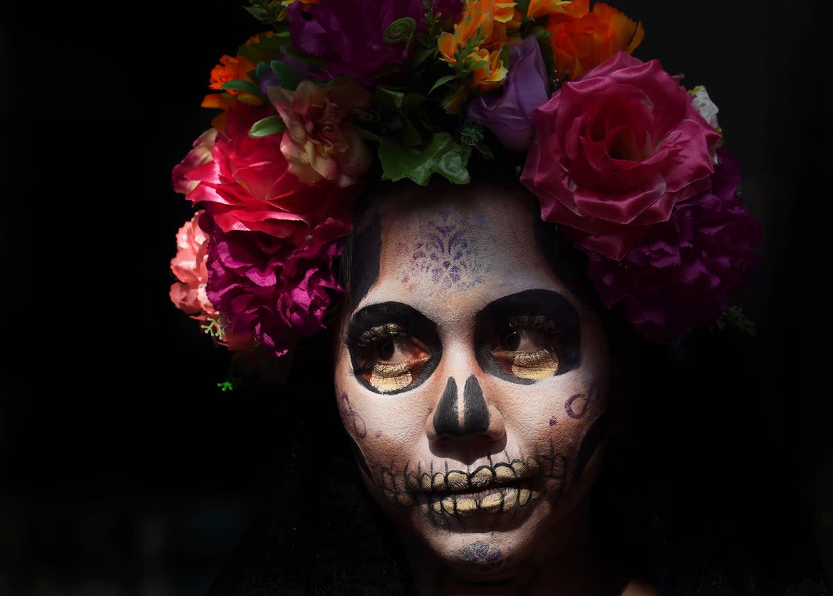 A woman dressed as La Catrina for Day of the Dead  (AP)