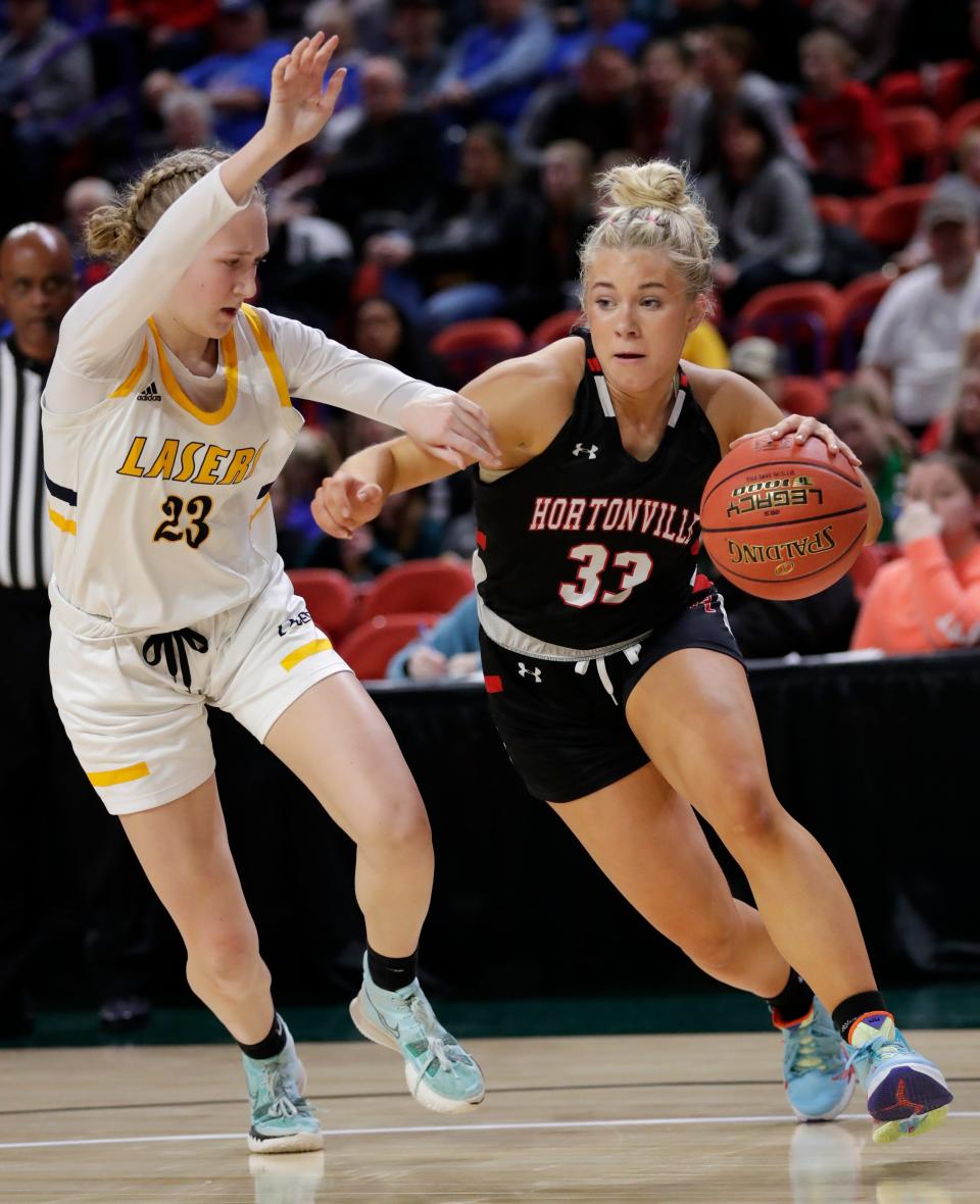 Hortonville's Paige Lillie (33) drives to the basket against Kettle Moraine's Keegan Lodes during their WIAA Division 1 girls basketball semifinal game March 10 at the Resch Center in Ashwaubenon.