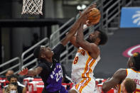 Atlanta Hawks forward Solomon Hill (18) shoots in front of Toronto Raptors forward Chris Boucher (25) during the second half of an NBA basketball game Tuesday, April 13, 2021, in Tampa, Fla. (AP Photo/Chris O'Meara)