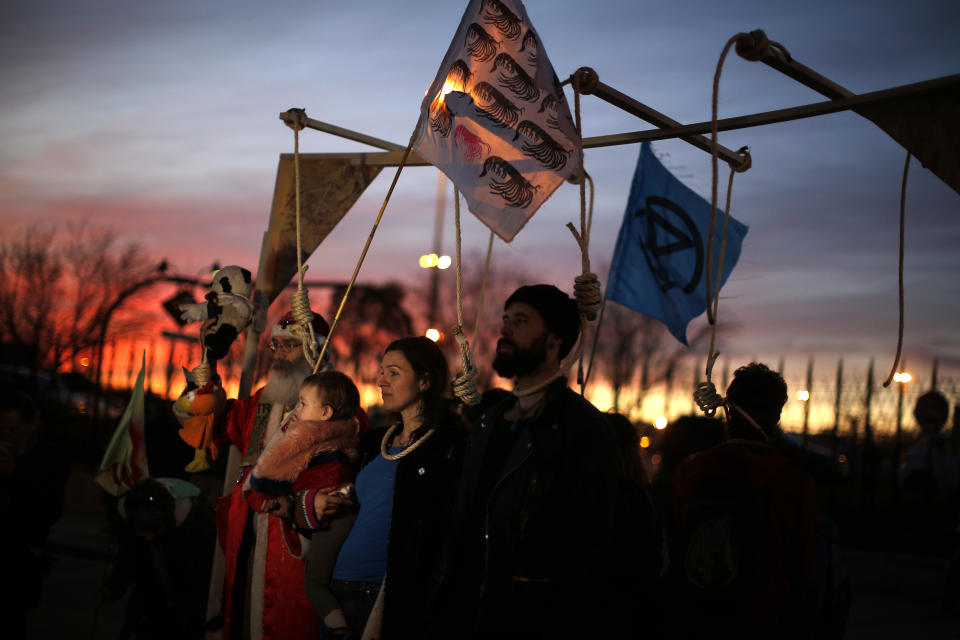 Activist protest outside of the COP25 climate talks congress in Madrid, Spain, Saturday, Dec. 14, 2019. The United Nations Secretary-General has warned that failure to tackle global warming could result in economic disaster. (AP Photo/Manu Fernandez)