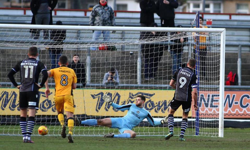 Chris Porter equalises for Colchester from the penalty spot.