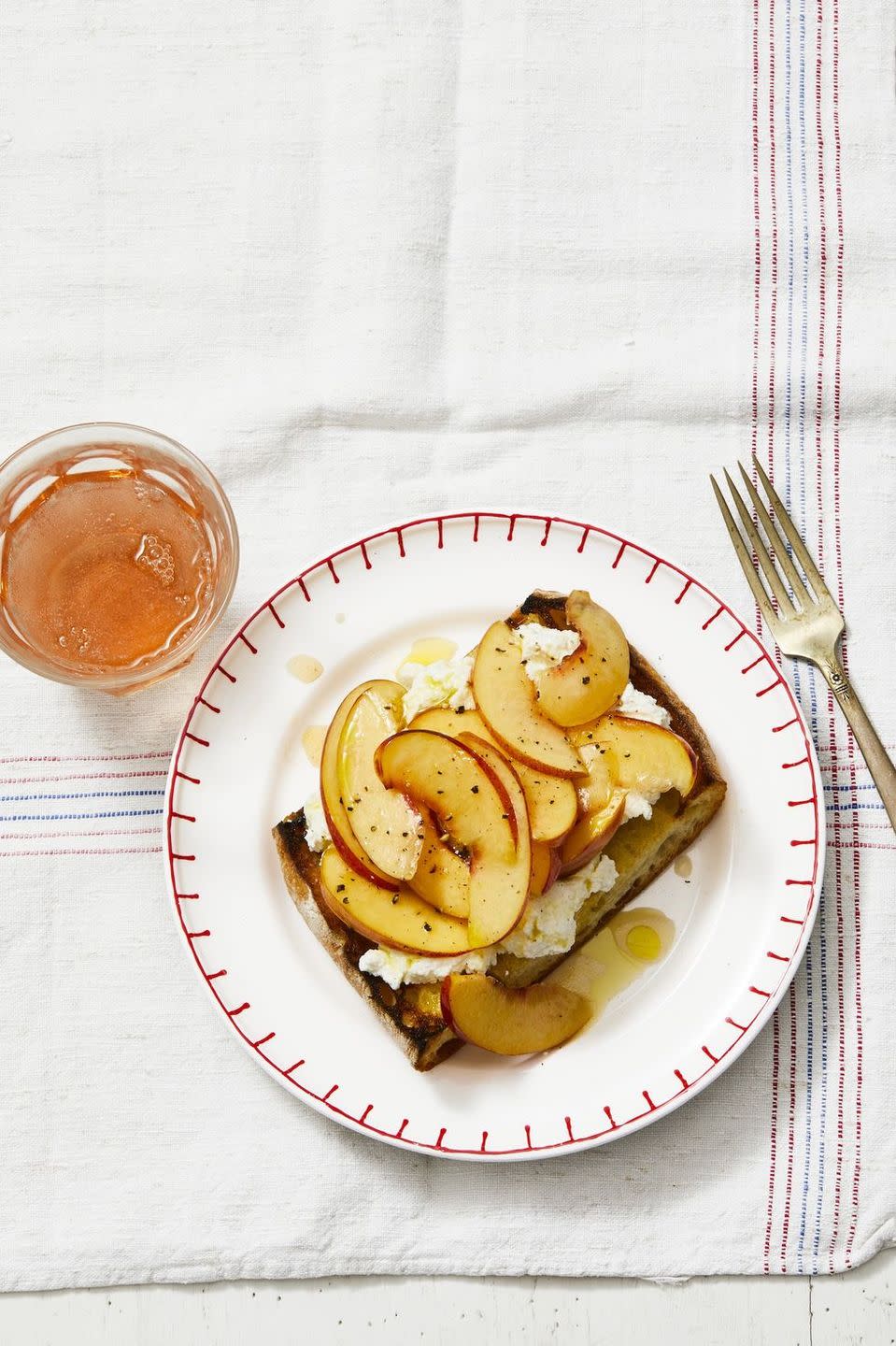 <p>Simple and sophisticated, this fruity toast is perfect for breakfast.</p><p>Get the <a href="https://www.goodhousekeeping.com/food-recipes/a27529312/nectarine-bruschetta-recipe/" rel="nofollow noopener" target="_blank" data-ylk="slk:Nectarine Bruschetta recipe;elm:context_link;itc:0;sec:content-canvas" class="link "><strong>Nectarine Bruschetta recipe</strong></a><em>.</em></p>