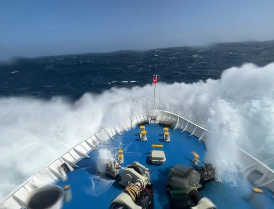 The boat hitting the water after a giant wave.