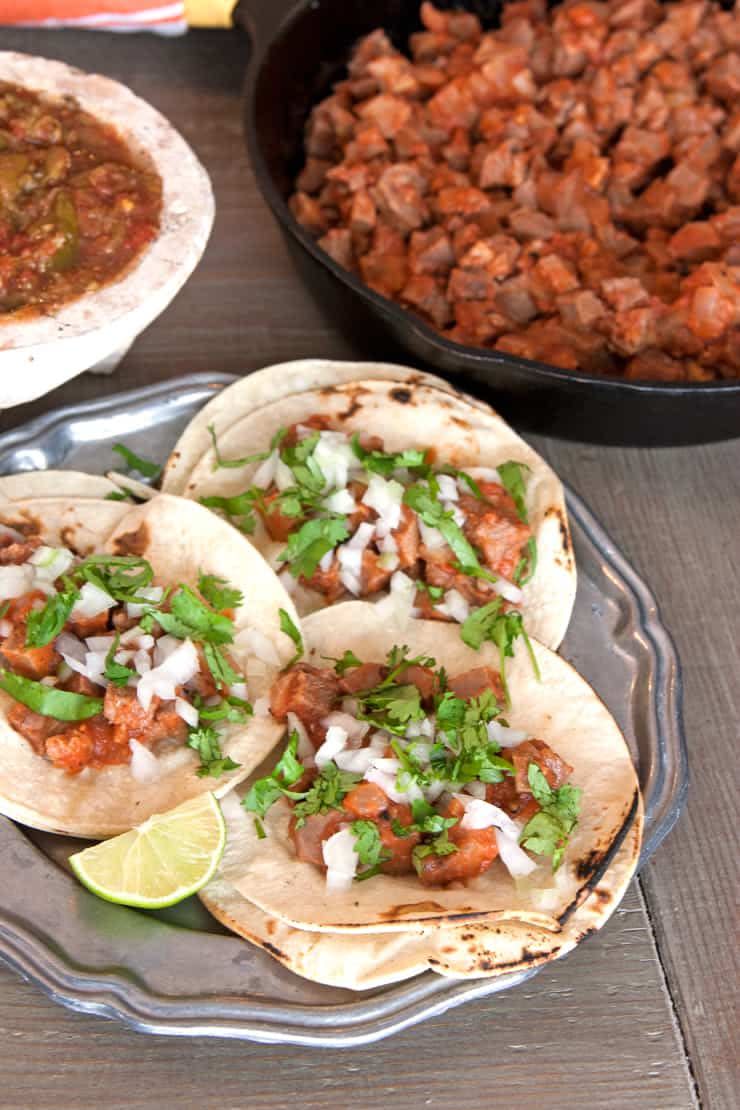 <p>When it’s cooked the right way, this popular Mexican street food is extremely tender and perfect for layering into warmed tortillas. Top the cooked beef tongue with your favorite toppings—salsa, chopped onion, cilantro, or avocado.</p><p><strong>Get the recipe at <a href="https://muybuenocookbook.com/beef-tacos-de-lengua/" rel="nofollow noopener" target="_blank" data-ylk="slk:Muy Bueno Cookbook;elm:context_link;itc:0;sec:content-canvas" class="link ">Muy Bueno Cookbook</a>.</strong></p><p><strong><a class="link " href="https://go.redirectingat.com?id=74968X1596630&url=https%3A%2F%2Fwww.walmart.com%2Fsearch%2F%3Fquery%3Dmeasuring%2Bspoons&sref=https%3A%2F%2Fwww.thepioneerwoman.com%2Ffood-cooking%2Fmeals-menus%2Fg36008054%2Ftypes-of-tacos%2F" rel="nofollow noopener" target="_blank" data-ylk="slk:SHOP MEASURING SPOONS;elm:context_link;itc:0;sec:content-canvas">SHOP MEASURING SPOONS</a><br></strong></p>