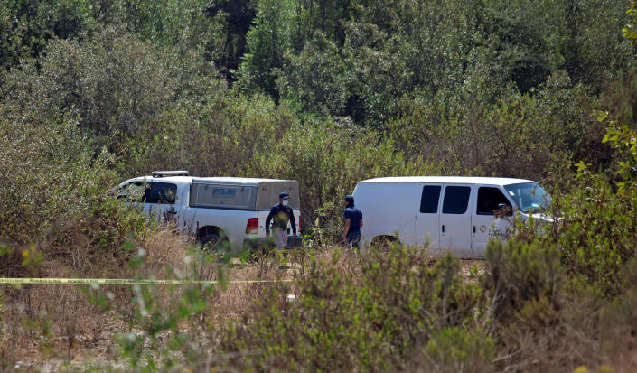 Image: Forensic technicians work at the scene where two American children were found dead in Rosarito (Reuters)