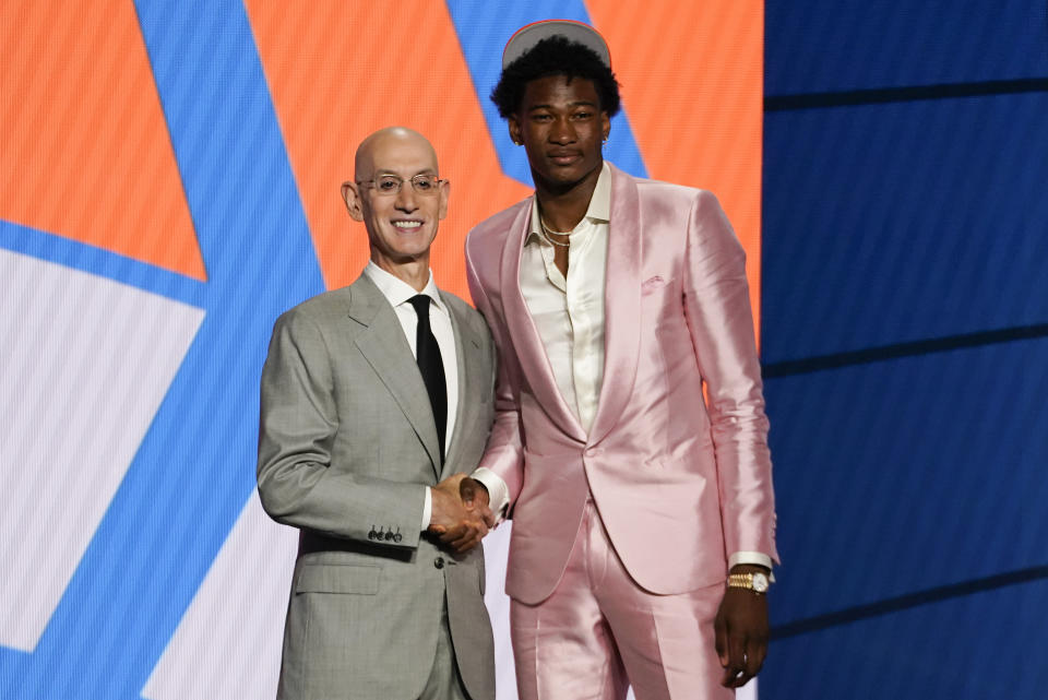 Kai Jones poses for a photo with NBA Commissioner Adam Silver after being selected as the 19th overall pick by the New York Knicks during the NBA basketball draft, Thursday, July 29, 2021, in New York. (AP Photo/Corey Sipkin)