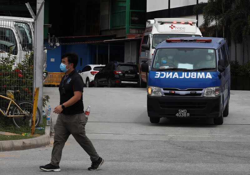 Ambulances leave the Punggol S11 migrant workers' dormitory during the coronavirus outbreak (COVID-19) in Singapore