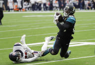 <p>Jacksonville Jaguars wide receiver Allen Hurns (88) is tripped up by Houston Texans cornerback Kevin Johnson (30) after a reception during the second half of an NFL football game, Sunday, Sept. 10, 2017, in Houston. (AP Photo/David J. Phillip) </p>