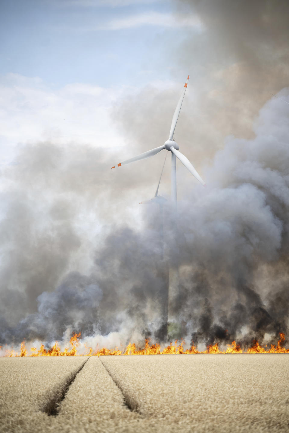 A field in an onshore wind farm is on fire near the town of Zoerbig, eastern Germany, Saturday, July 15, 2023. (Hannes P. Albert/dpa via AP)