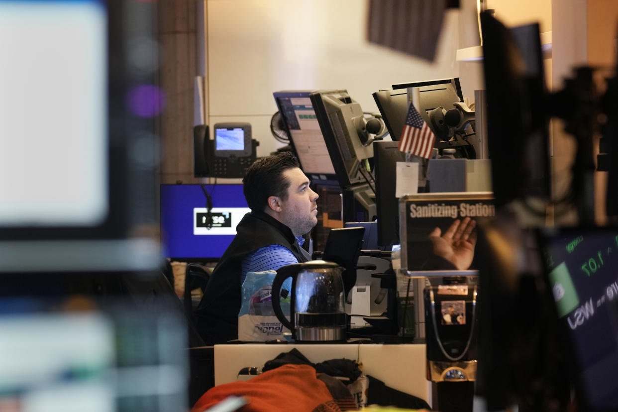 Traders work on the floor at the New York Stock Exchange in New York, Friday, June 2, 2023. (AP Photo/Seth Wenig)