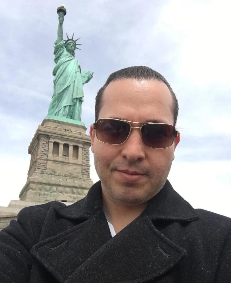 Eyvin Hernandez poses in front of the Statue of Liberty in this selfie taken during his visit to New York City in May 2018. Hernandez, from Los Angeles, is one of at least three American citizens who were quietly arrested in 2022 allegedly trying to enter Venezuela illegally and are being held at a maximum security prison facing long sentences, The Associated Press has learned. (Hernandez family via AP)