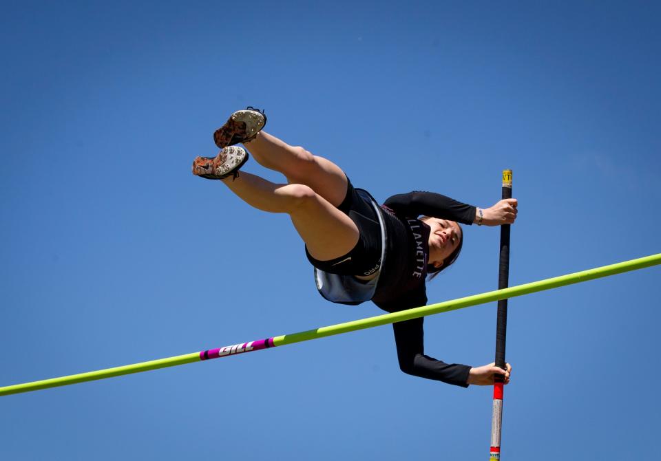 Willamette's Rhys Allen clears the bar in the 5A girls pole vault at the OSAA State Track & Field Championships at Hayward Field Saturday, May 21, 2022.