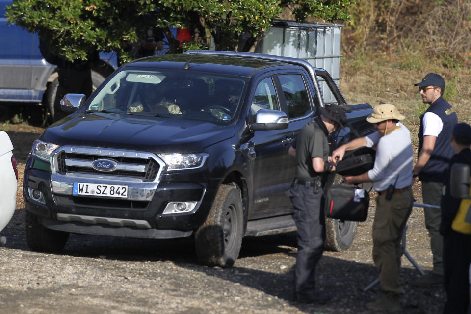 A German registered vehicle prepares to drives away as police search teams set out from an operation tent near Barragem do Arade, Portugal, Wednesday May 24, 2023. Portuguese police aided by German and British officers have resumed their search for Madeleine McCann, the British child who disappeared in the country's southern Algarve region 16 years ago. Some 30 officers could be seen in the area by the Arade dam, about 50 kilometers (30 miles) from Praia da Luz, where the 3-year-old was last seen alive in 2007. (AP Photo/Joao Matos)