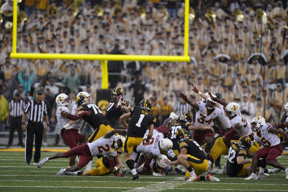 FILE - Iowa place kicker Aaron Blom (1) misses a field goal at the end of an NCAA college football game against Iowa State, Saturday, Sept. 10, 2022, in Iowa City, Iowa. Iowa State won 10-7. A former walk-on kicker at the University of Iowa was charged Wednesday, Aug. 2, 2023, in connection with wagering on Hawkeyes sports events — one day after Iowa State quarterback Hunter Dekkers was accused of committing the same offense. The criminal complaint filed in Johnson County said Aaron Blom, who was on the Iowa roster from 2020-22, tampered with records related to an Iowa Criminal Division investigation into sports gambling. (AP Photo/Charlie Neibergall, File)